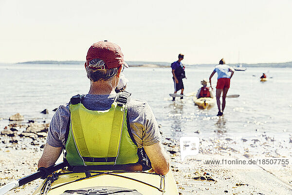 Family prepares to go kayaking in Casco Bay  Maine after renting kayak