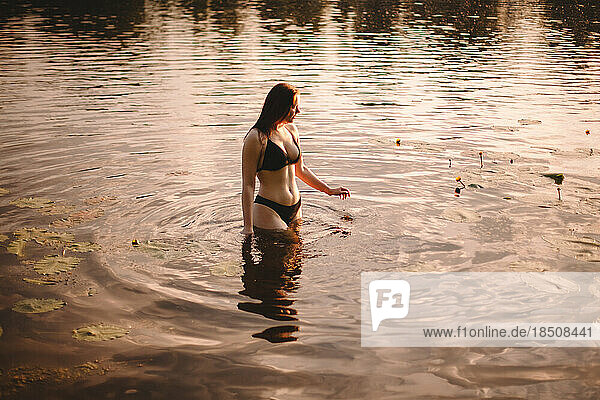 Seductive woman in lake