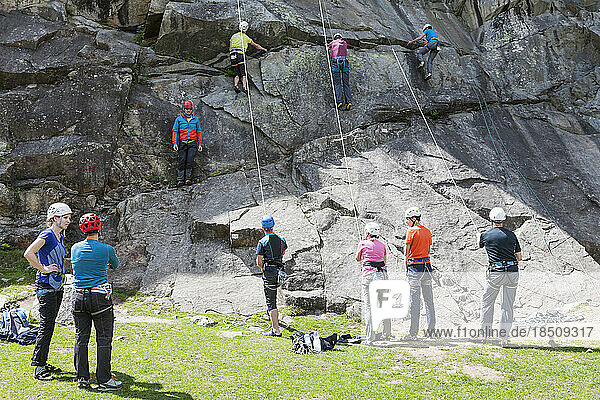 Group of climbers with safety equipment on rock  Otztal  Tyrol  Austria