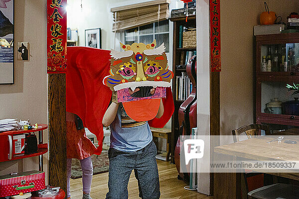 Two children perform Chinese lion dance for Lunar New Year