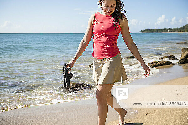 Solo woman enjoying a beach walk in Puerto Rico