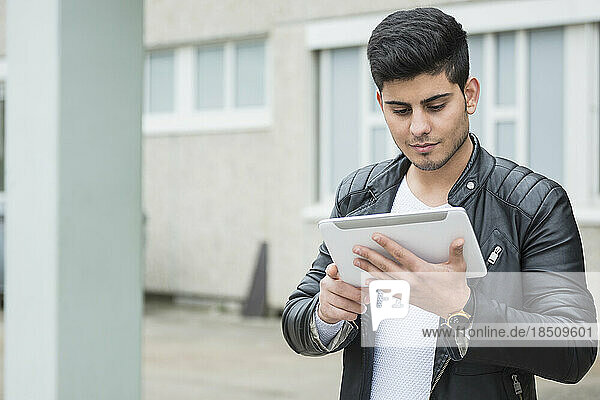 University student using digital tablet in campus School  Bavaria  Germany