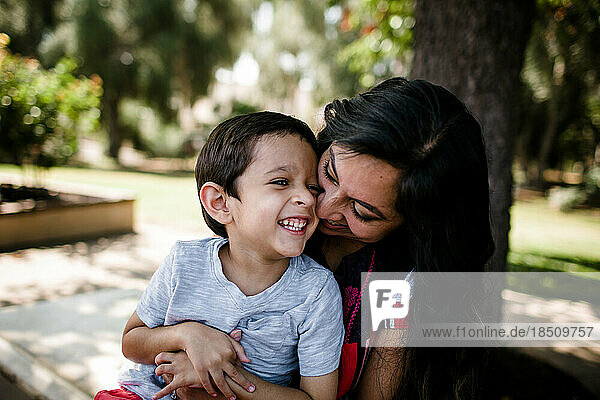 Mother & Autistic Son Laughing & Hugging
