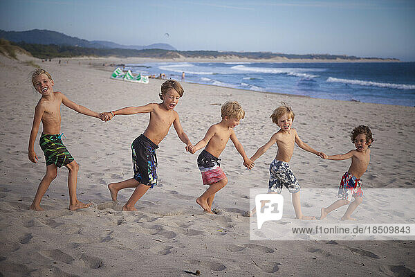 Group of kids playing on the beach  Viana do Castelo  Norte Region  Portugal