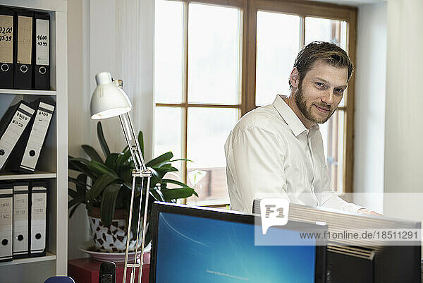 Portrait of a mid adult businessman in an office  Bavaria  Germany