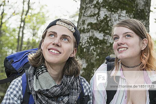Close-up of a young couple hiker dreaming in a forest  Bavaria  Germany