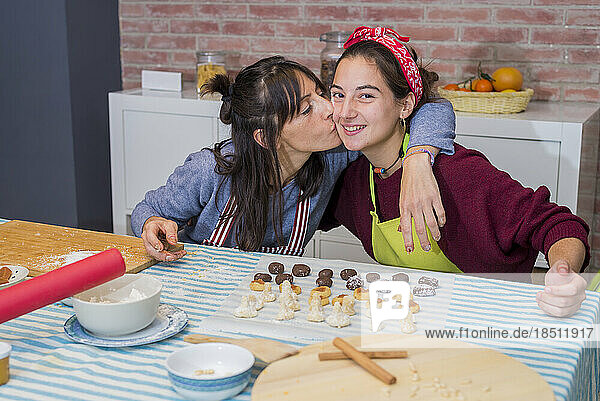 Mother And Daughter baking a homemade traditinal pastry