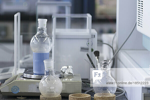 Flask and container on weight scale in a laboratory  Freiburg im Breisgau  Baden-Württemberg  Germany