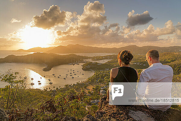 Man and woman admiring sunset over English Harbour  Antigua