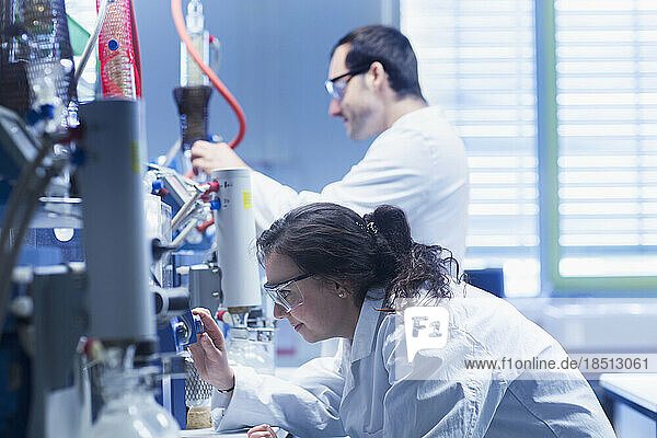 Young scientists examining in a laboratory  Freiburg Im Breisgau  Baden-wuerttemberg  Germany