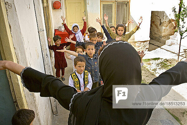 After the kids wake up from their nap  a teacher leads exercises at Habiba's child care in Kabul.