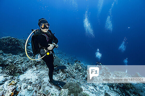 diver standing on the ocean floor at Banda Sea / Indonesia