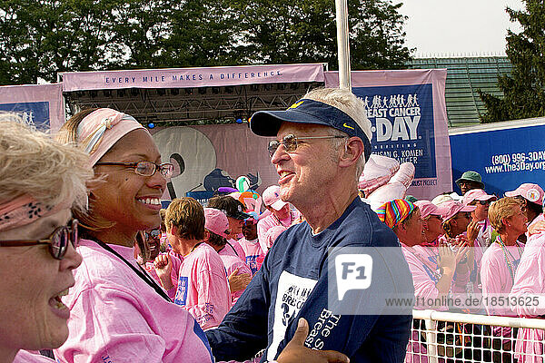 Walkers congratulate each other after walking 60 miles in the Komen 3-Day walk for breast cancer in Detroit.