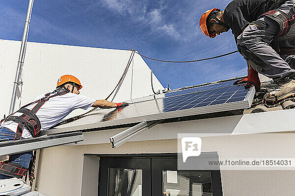 Engineers working with solar panels