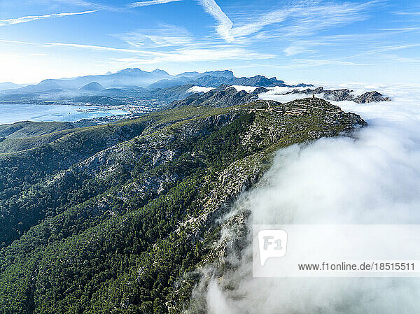 Spain  Balearic Islands  Port de Pollenca  Aerial view of coastal mountains shrouded in thick fog