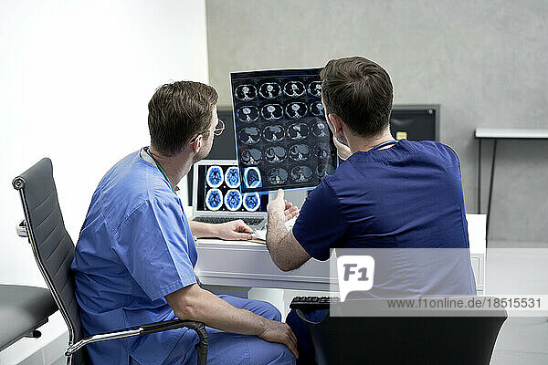 Doctors examining medical x-ray in hospital