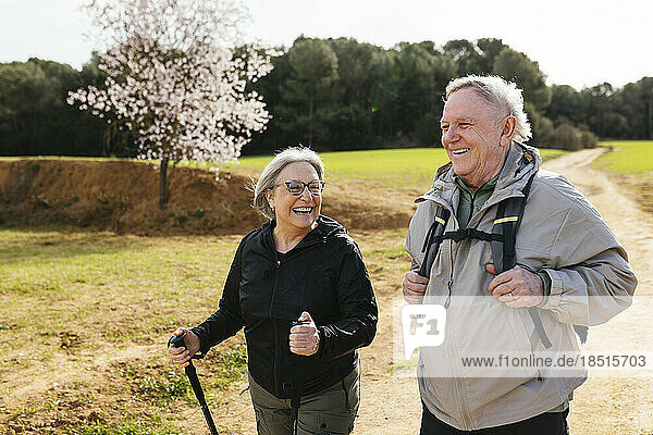 Senior couple hiking together on hiking path