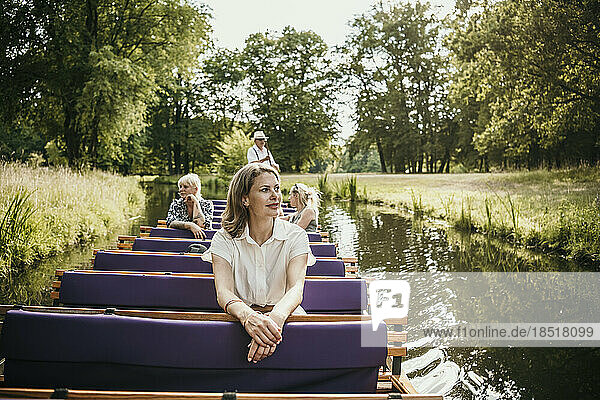 Tourists exploring Park Branitz sitting in boat on lake
