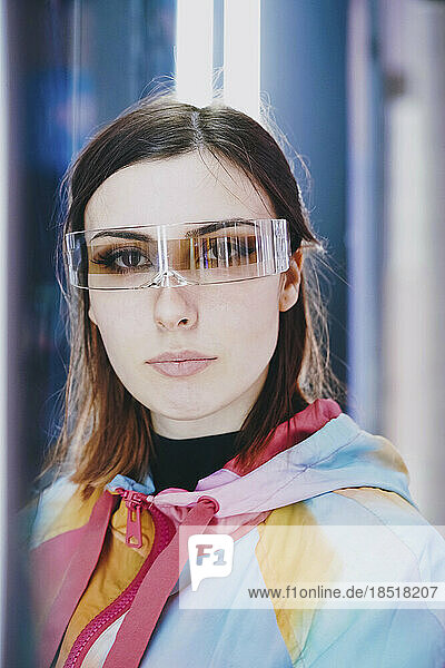 Beautiful young woman wearing smart glasses