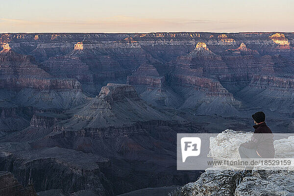 United States  Arizona  Grand Canyon National Park  South Rim  Senior female hiker sitting on rock