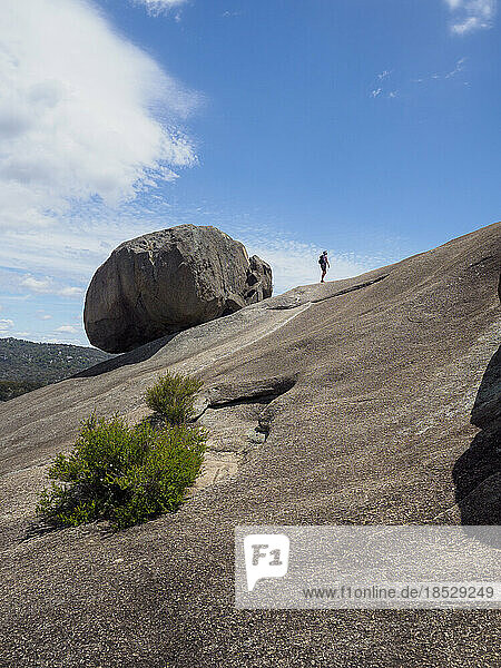Australia  Queensland  Girraween National Park  Woman hiking on rock formation