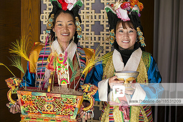 Two women in Tibetan clothing in Lhasa; Lhasa  Tibet
