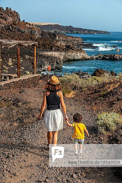 Mother and son on vacation by the beach of Tacoron on El Hierro  Canary Islands