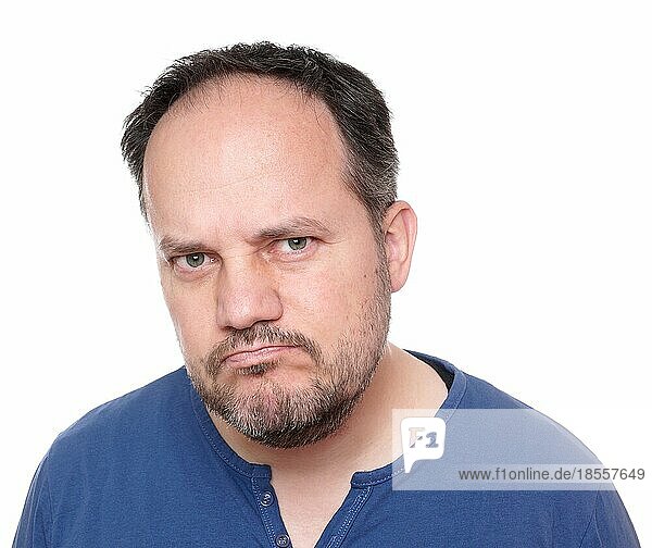 middle aged man looking skeptical and unhappy