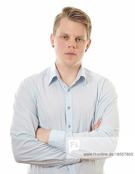 young buisness man with folded arms looking serious