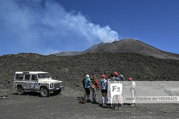 Hikers in the crater landscape of the volcano Etna  summit region  province of Catania  Sicily  Italy  Europe