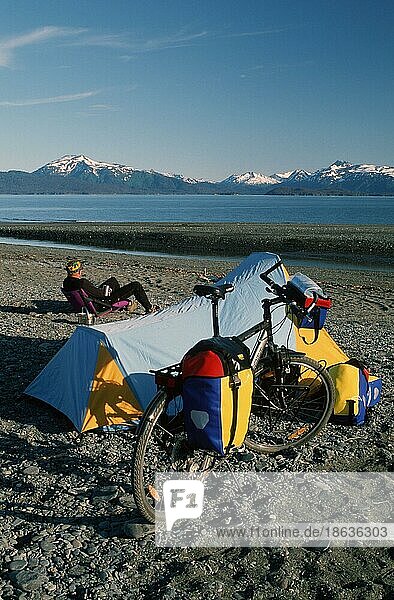 Man with tent and bike at Kachemak Bay  Alaska  USA  North America
