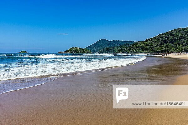 Paradise beach surrounded by rainforest and hills on a sunny day in Bertioga on the coast of Sao Paulo  Bertioga  Sao Paulo  Brasil