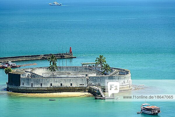 Ancient and historic fortress surrounded by the clear waters of the Salvador sea and built in the 17th century  Brasil