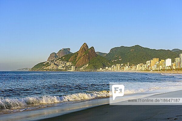 Dawn at Ipanema beach in Rio de Janeiro still empty with its buildings and mountains around  Ipanema beach  Rio de Janeiro  Rio de Janeiro  Brasil