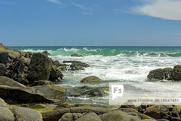 Rocky beach and its waves on the coast of the city of Salvador in Bahia in the northeast region of Brazil  Brasil