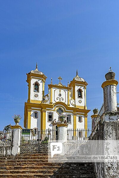 Facade of a historic church in Ouro Preto with blue sky in the background on sunny days  Brasil