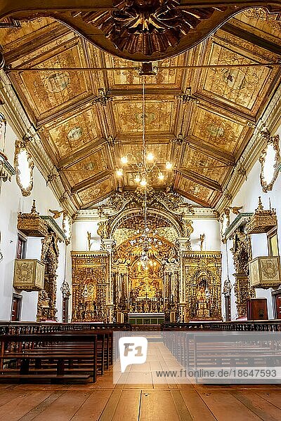 Interior and altar of a brazilian historic ancient church from the 18th century in baroque architecture with details of the walls in gold leaf in the city of Tiradentes  a UNESCO World Heritage Site  Minas Gerais State  Brazil  Brasil  South America