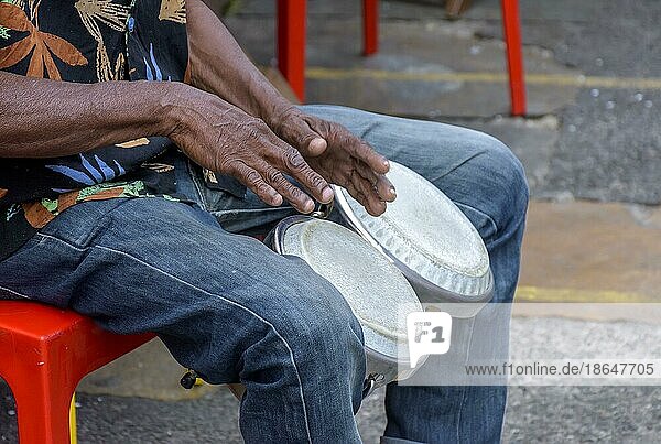 Bongos drum player in the streets of Salvador city during brazilian samba presentation  Brasil