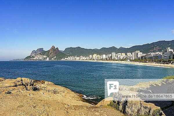 Panorama of Ipanema beach in Rio de Janeiro on a beautiful day with the sea  buildings and hills around in the morning  Brasil
