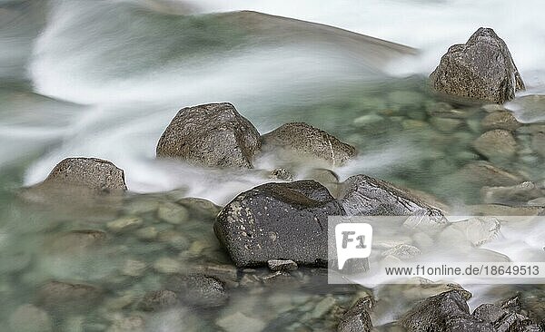 Water flowing over stones long exposure detail river Driva Åmotan Gorge Gjøra Norway Europe