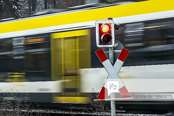 Level crossing with regional train  flashing warning light  Blaustein  Baden-Württemberg  Germany  Europe
