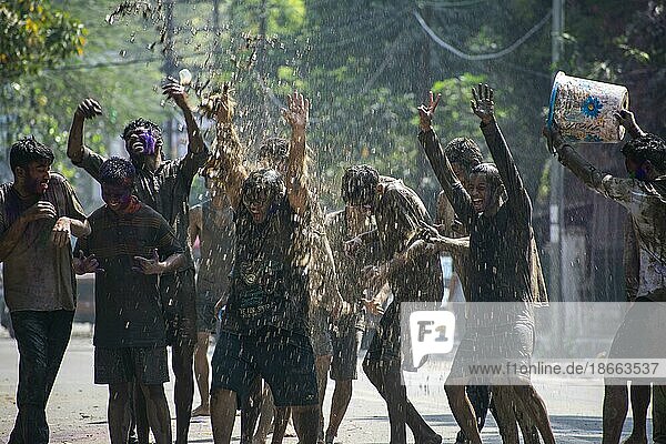 Revellers palying mud to celebrate Holi  the Hindu spring festival of colours  in Guwahati  Assam  India on 7 March 2023