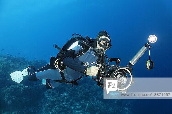 Cameraman with professional underwater video camera type RED Dragon X 6K Digital Cinema Camera in Nauticam underwater housing  Sulu Sea  Pacific Ocean  Palawan  Calamian Islands  Philippines  Asia