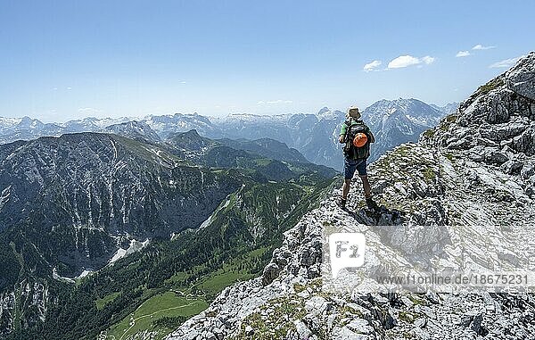 Mountaineer on the ridge of the Hoher Brett  during the traverse from the Hoher Göll to the Hoher Brett  view into the Hagengebirge  Berchtesgaden Alps  Berchtesgadener Land  Bavaria  Germany  Europe