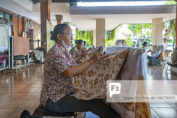 Lady garment painting batik artwork  Kesiman Kertalangu  East Denpasar  Denpasar City  Bali  Indonesia  South East Asia  Asia