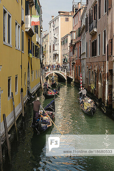 Gondolas with tourists on canal  Venice  UNESCO World Heritage Site  Veneto  Italy  Europe