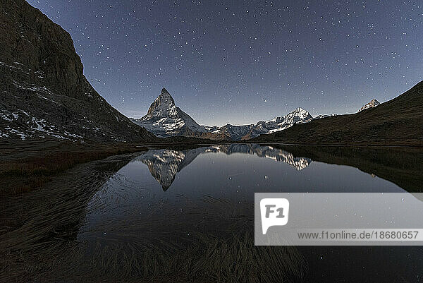Matterhorn reflection in Riffelsee lake in a starry night  Gornergrat  Zermatt  canton of Valais  Swiss Alps  Switzerland  Europe