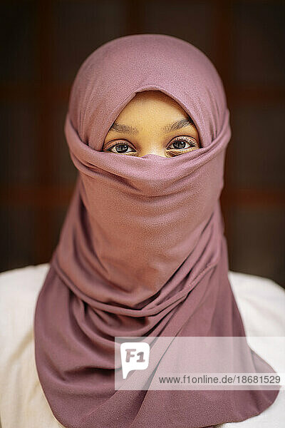 Portrait of young woman in hijab