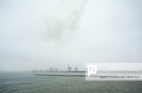 North Sea and Port of Rotterdam during storm with snowfall,  Netherlands