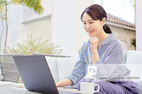Japanese woman working on laptop